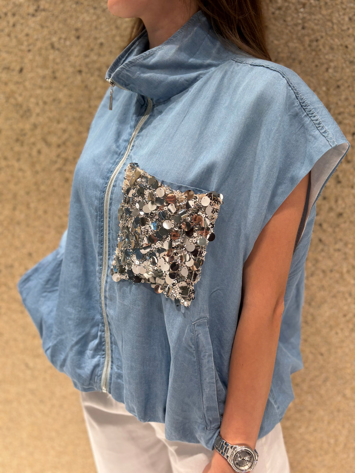 Gilet con tasca pailletes