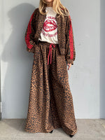 Pantalone maculato con banda laterale