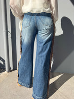 Jeans con frange laterali