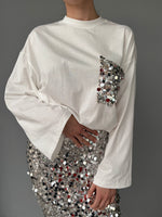 T-shirt modello largo con tasca frange