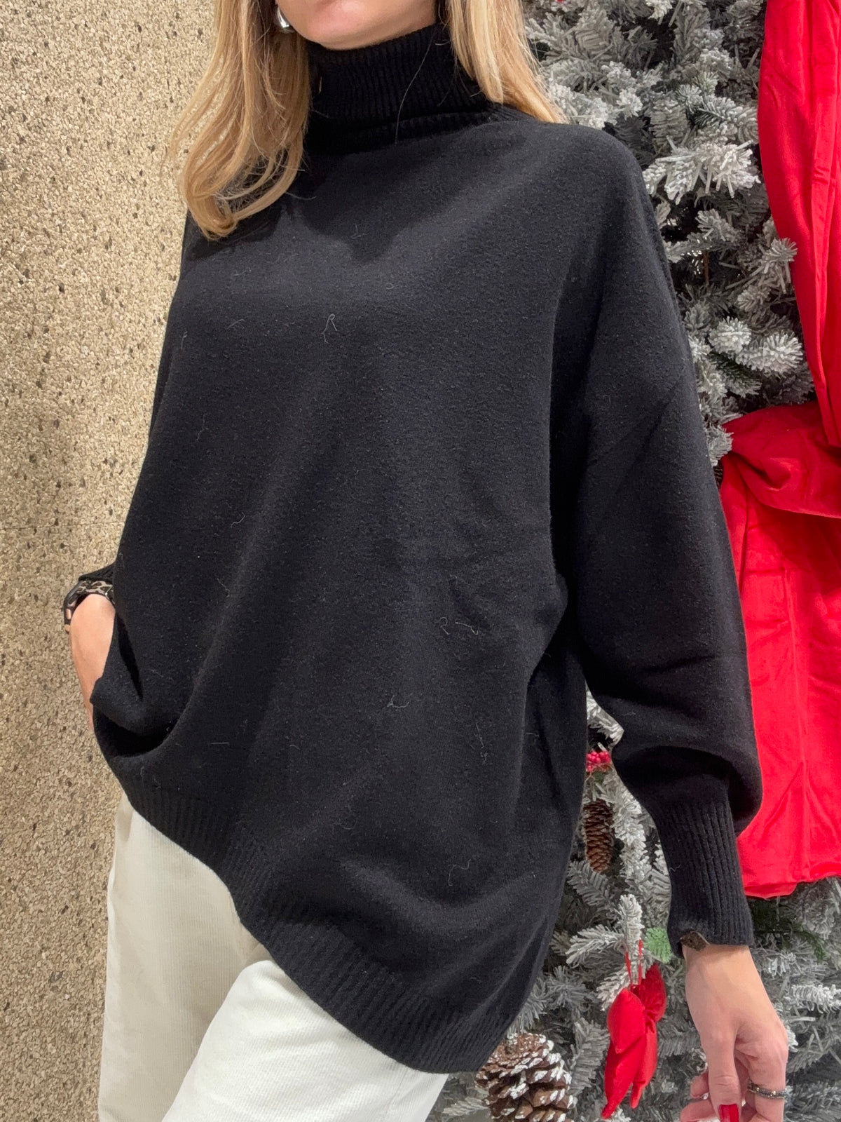 Maglia collo alto svasata