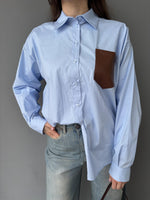 Camicia con tasca in ecopelle intrecciata