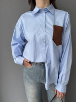 Camicia con tasca in ecopelle intrecciata