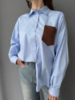 Camicia con tasca in ecopelle intrecciata