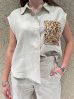 Camicia smanicata con tasca pailletes