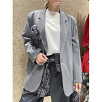 Blazer con spilla